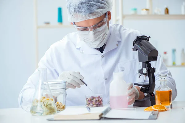 Chemist mixing perfumes in the lab