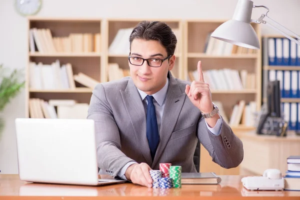 Businessman gambling playing cards at work — Stock Photo, Image