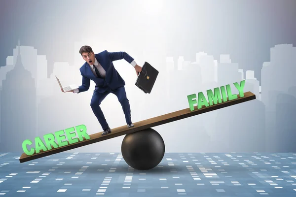 Businessman balancing between career and family in business conc — Stock Photo, Image