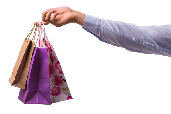Hand holding boodschappentassen met kerst winkelen op witte rug — Stockfoto