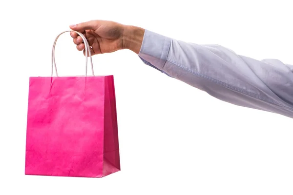 Hand hålla shoppingväskor med jul shopping på vit rygg — Stockfoto