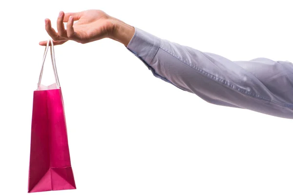 Hand holding shopping bags with christmas shopping on white back — Stock Photo, Image