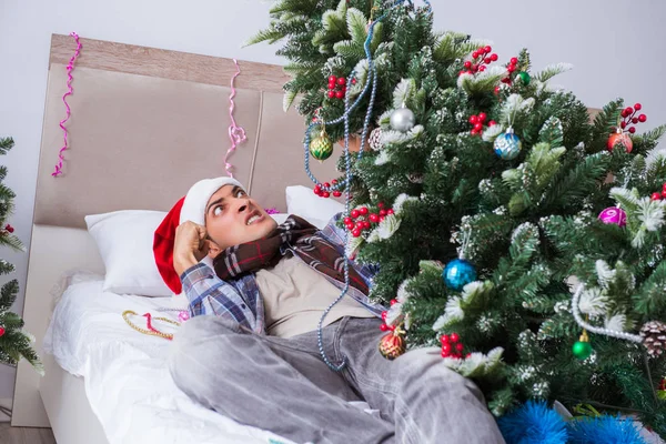 Man suffering hangover after christmas party — Stock Photo, Image