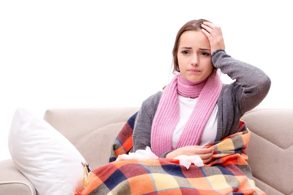 Teenager suffering from cold sitting on coach — Stock Photo, Image