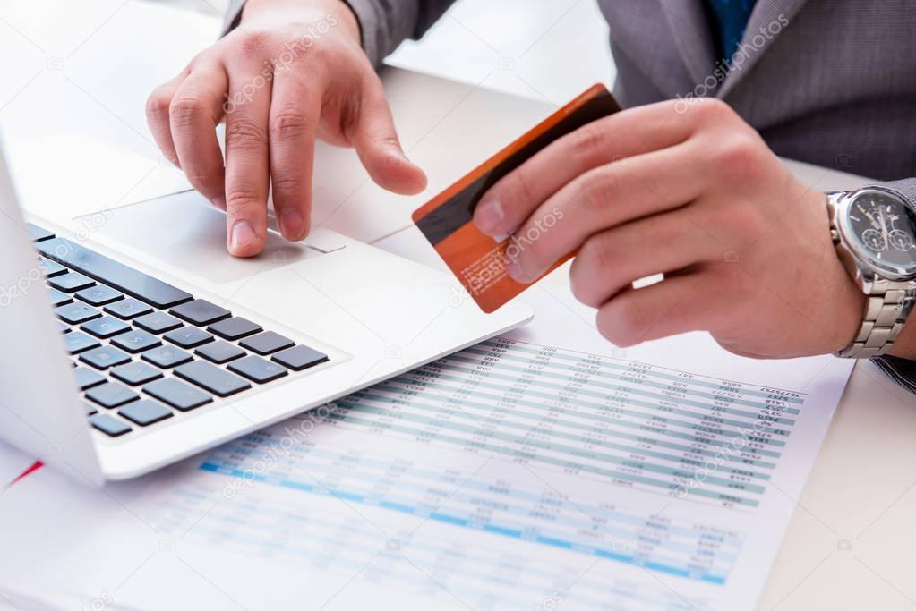 Male businessman doing online shopping with credit card