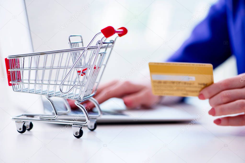 Businesswoman buying online using plastic credit card