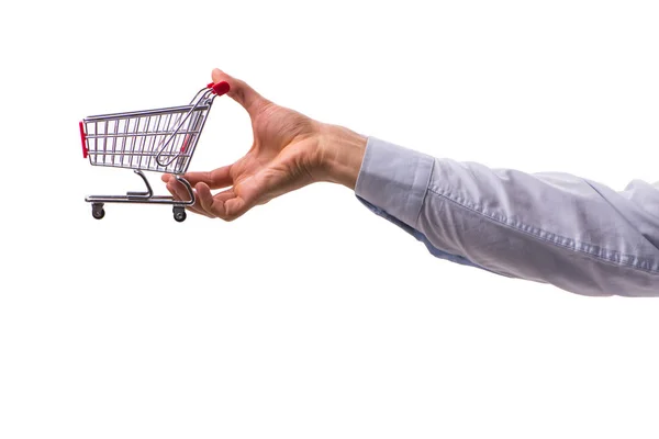 Mão segurando carrinho de compras isolado no branco — Fotografia de Stock