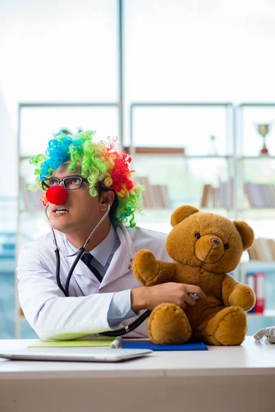 Funny pediatrician with toy in the hospital clinic — Stock Photo, Image
