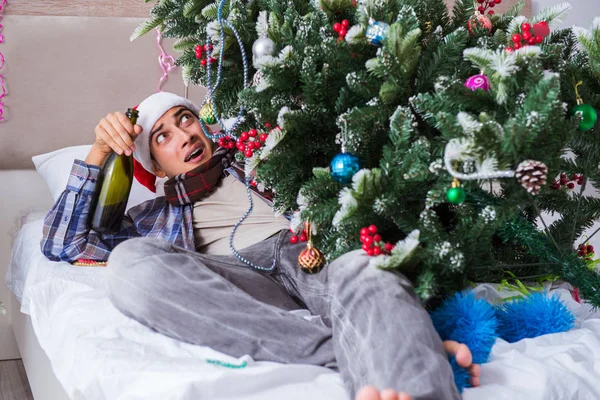 Man suffering hangover after christmas party — Stock Photo, Image