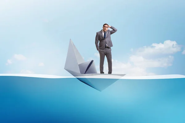 Businessman escaping sunken paper boat ship — Stock Photo, Image