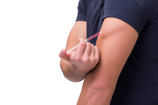 Young man in doping concept isolated on white