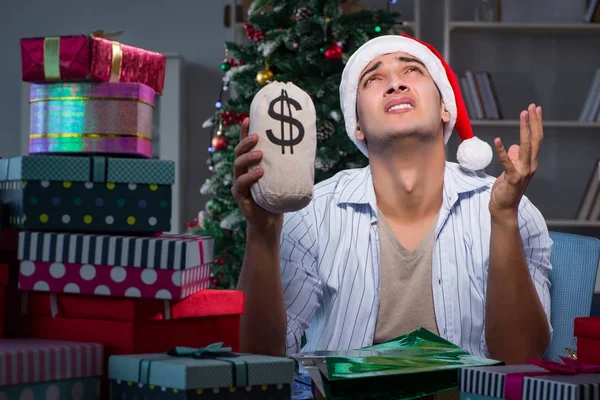 Man with many christmas gifts in boxes — Stock Photo, Image