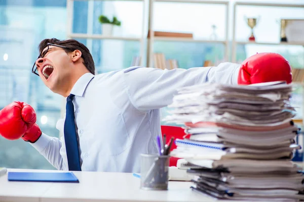 Businessman with boxing gloves in the office — Stock Photo, Image