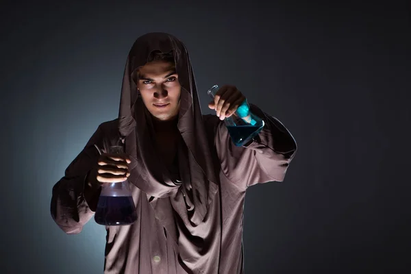 Alchemist doing experiments in alchemy concept — Stock Photo, Image