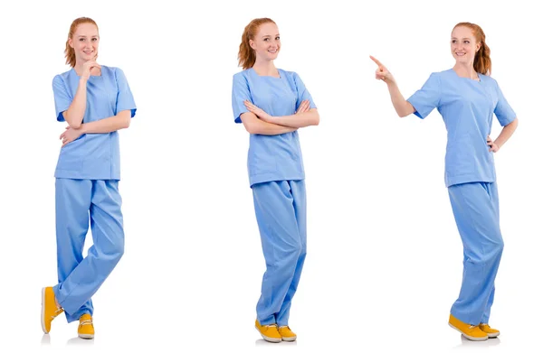 Grazioso medico in uniforme blu isolato su bianco — Foto Stock