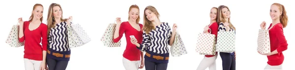 Friends with shopping bags isolated on white — Stock Photo, Image