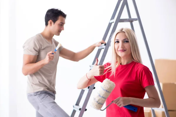 Young family doing painting job during home renovation — Stock Photo, Image