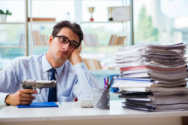 Angry businessman with gun thinking of committing suicide