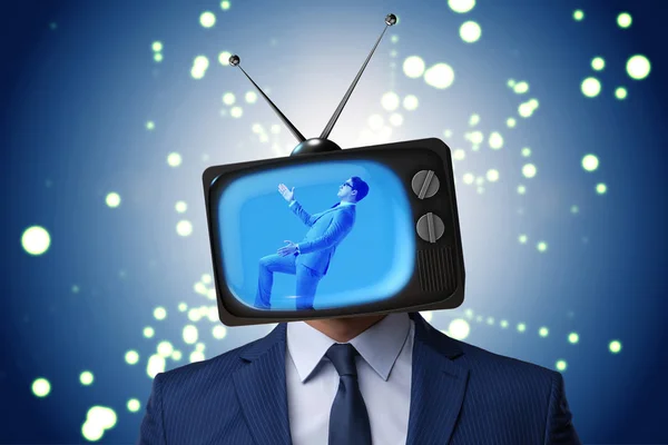 Man with television head in tv addiction concept