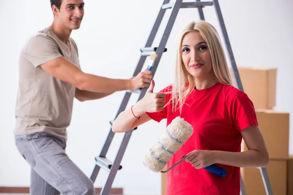 Young family doing painting job during home renovation — Stock Photo, Image