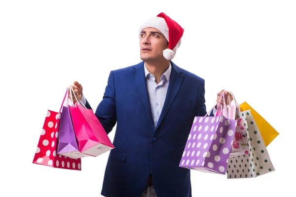 Junger Mann mit Taschen nach dem Weihnachtseinkauf auf weißem Hintergrund — Stockfoto