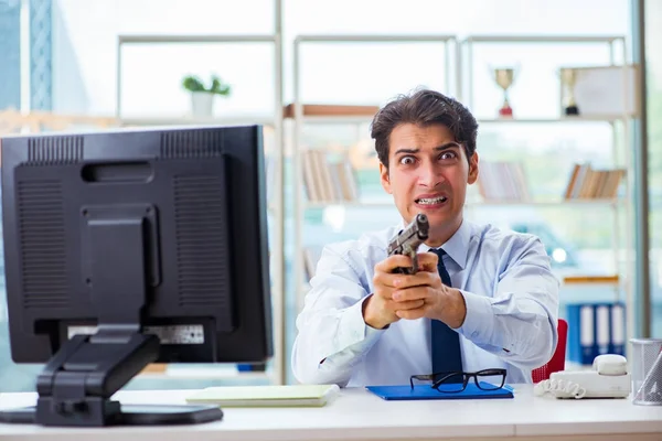 Angry businessman with gun thinking of committing suicide — Stock Photo, Image