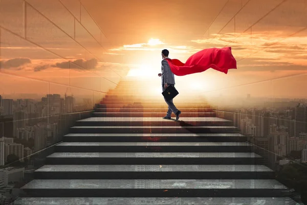 Businessman superhero successful in career ladder concept