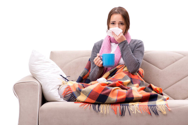 Teenager suffering from cold sitting on coach