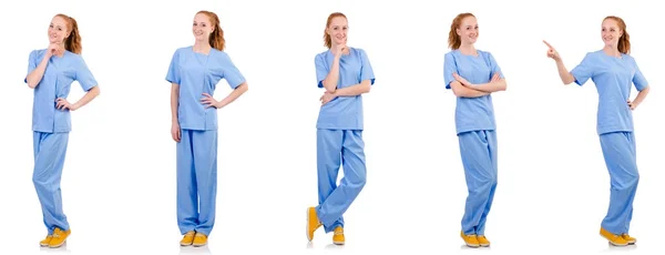 Grazioso medico in uniforme blu isolato su bianco — Foto Stock