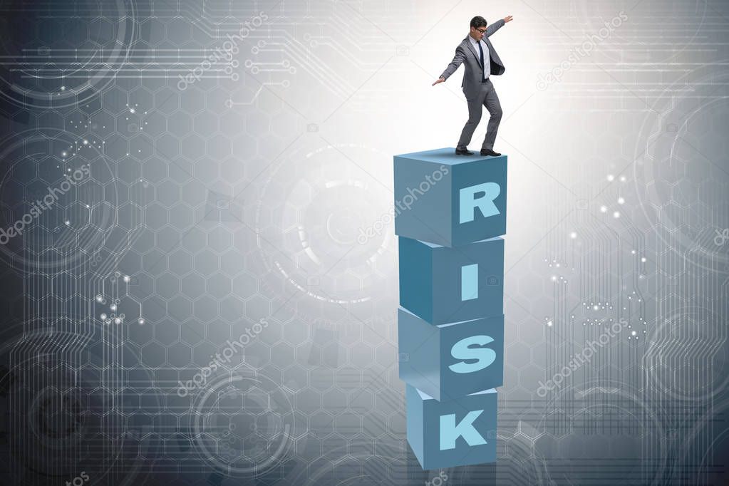 Businessman in risk and reward business concept