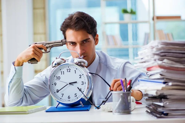 Angry businessman with gun thinking of committing suicide — Stock Photo, Image