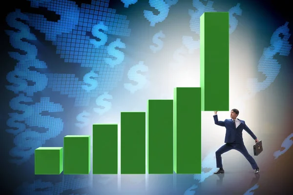 Affärsman som stöder tillväxten i ekonomin i diagrammet — Stockfoto