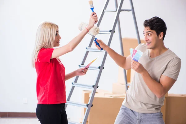 Young family doing painting job during home renovation — Stock Photo, Image