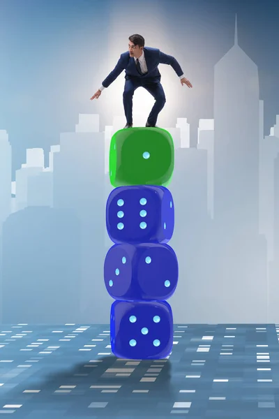 Businessman balancing on top of dice stack in uncertainty concep — Stock Photo, Image