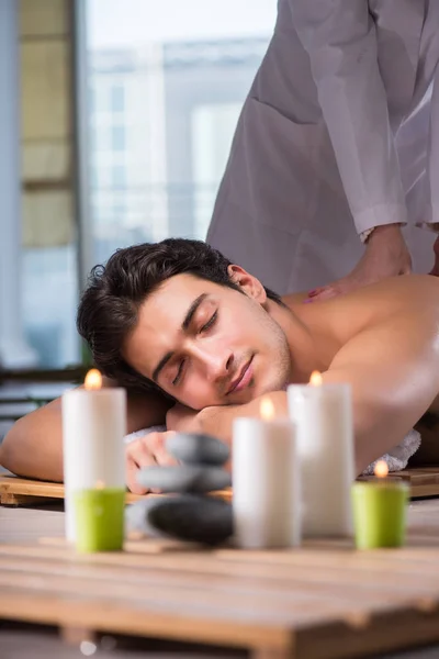 Young handsome man during spa procedure — Stock Photo, Image