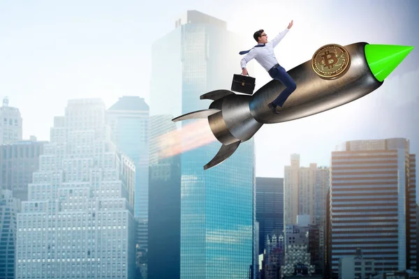 Businessman flying on rocket in bitcoin price rising concept — Stock Photo, Image