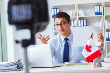 Blogger doing webcast on canadian immigration to Canada clipart