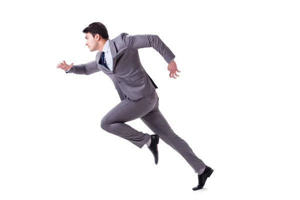 Молодой бизнесмен бежит вперед изолированный на белом — стоковое фото