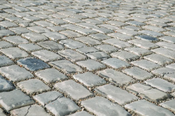 Estrada pavimentada com pedras de calhau para o seu fundo — Fotografia de Stock