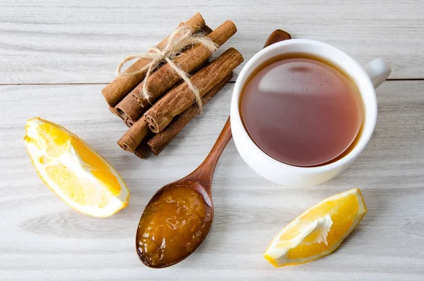 Cup of tea served with orange jam — Stock Photo, Image