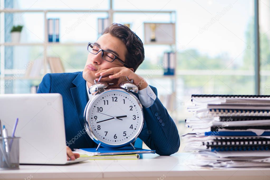 Businessman with giant clock failing to meet deadlines and missi