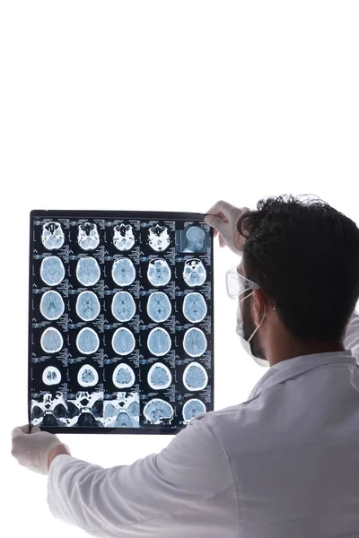 Young doctor looking at x-ray images isolated on white — Stock Photo, Image