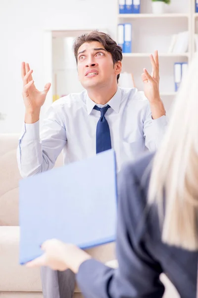 Young man visiting psychiatrist doctor for consultation — Stock Photo, Image