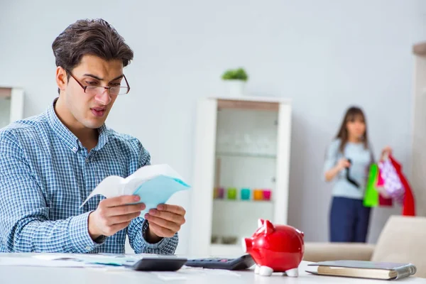 Young couple looking at family finance papers — Stock Photo, Image