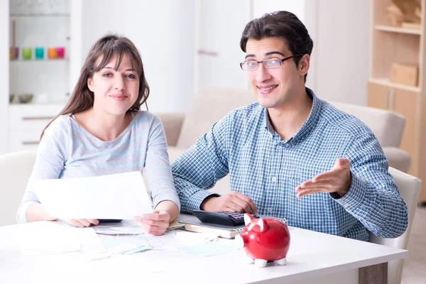 Young couple looking at family finance papers Stock Image