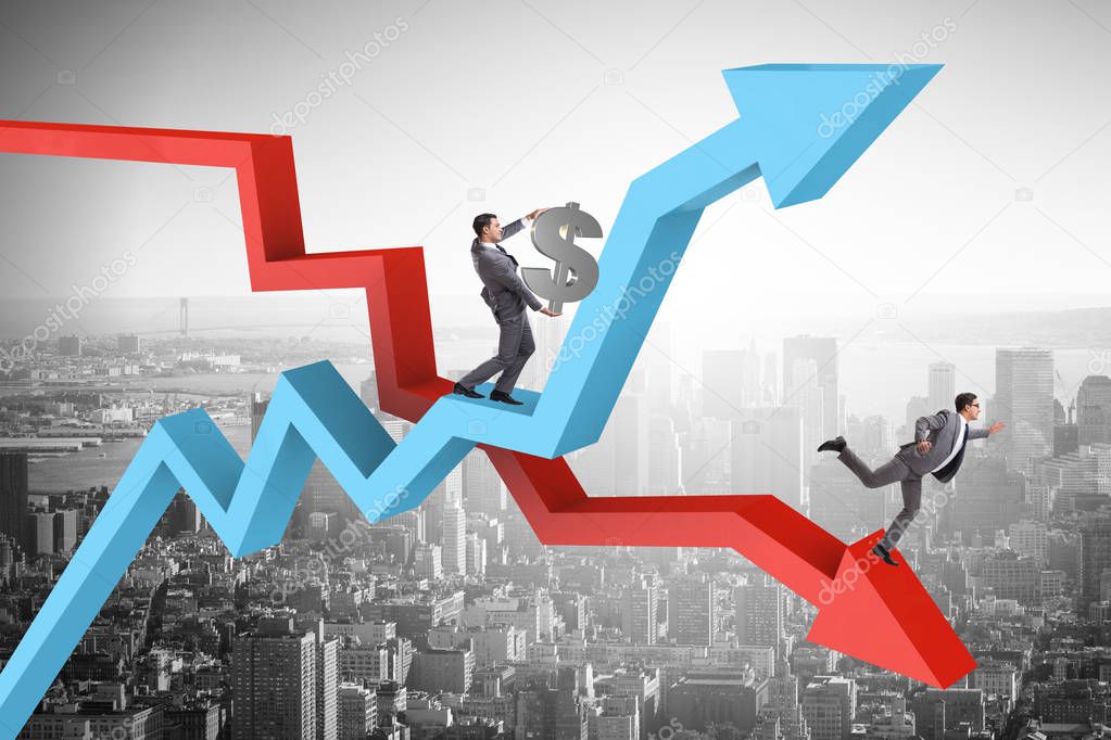 Businessman with charts of growth and decline