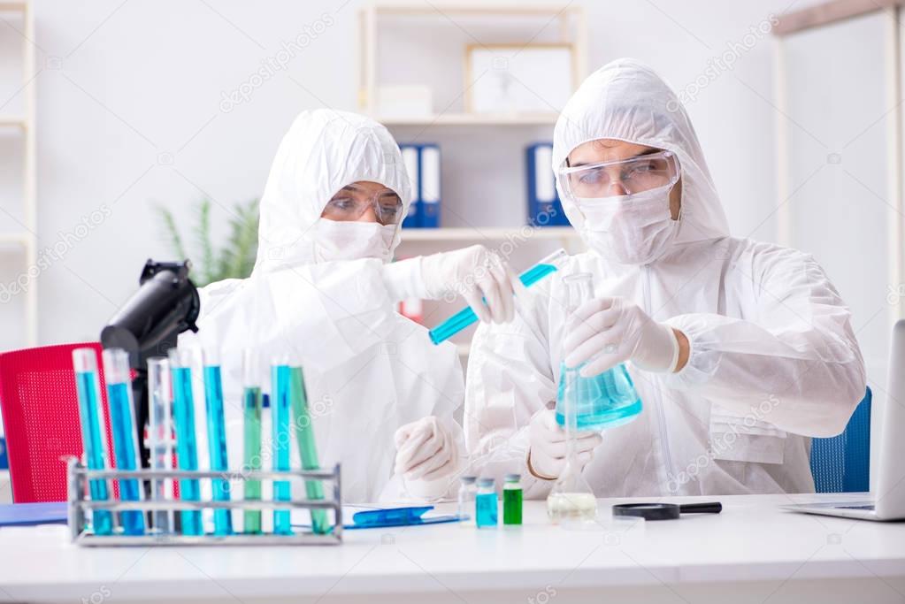 Two chemists working in the lab