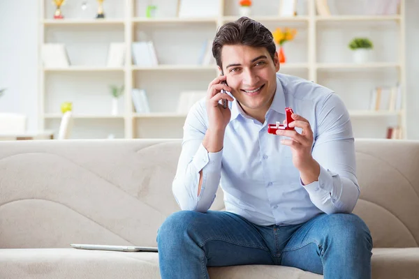 Young man chatting with his sweetheart over mobile phone