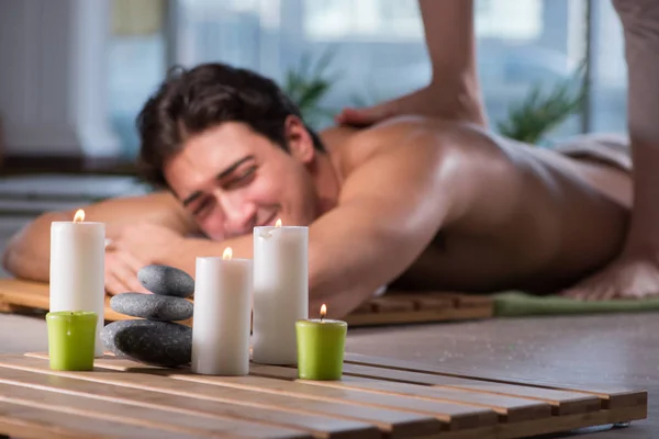 Young handsome man during spa procedure — Stock Photo, Image