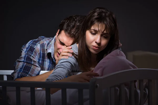 Young parents sleepless with newborn baby at night — Stock Photo, Image